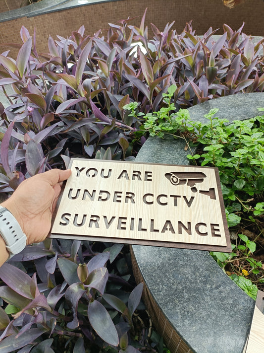 Wooden CCTV Surveillance Sign Board | YOU ARE UNDER CCTV SURVEILLANCE | Laser Cut MDF | 6x10 Inch | 7MM Thickness | Peel & Stick Tape Mount | For Door, Wall, Office, Shop